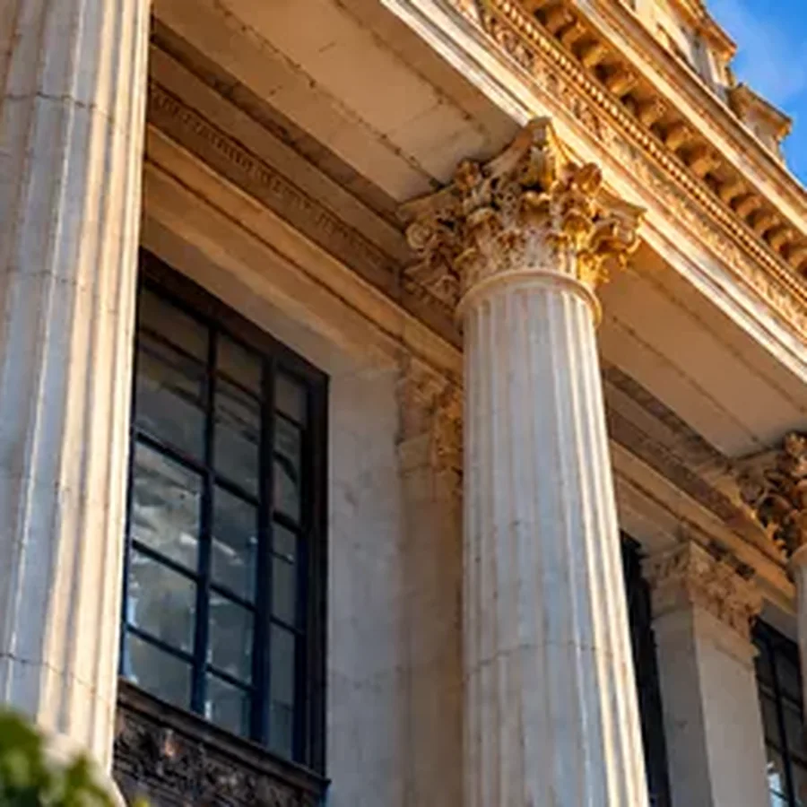 Grand Neoclassical Facade with Fluttering Flags