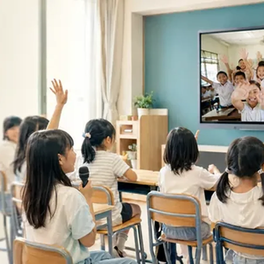 Japanese students greet a remote classroom